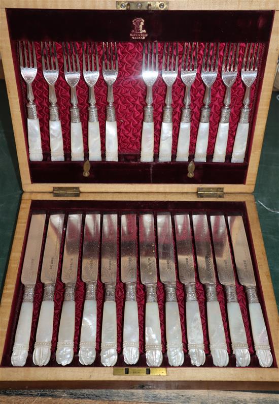 A set pearl handled dessert eaters (one fork missing)